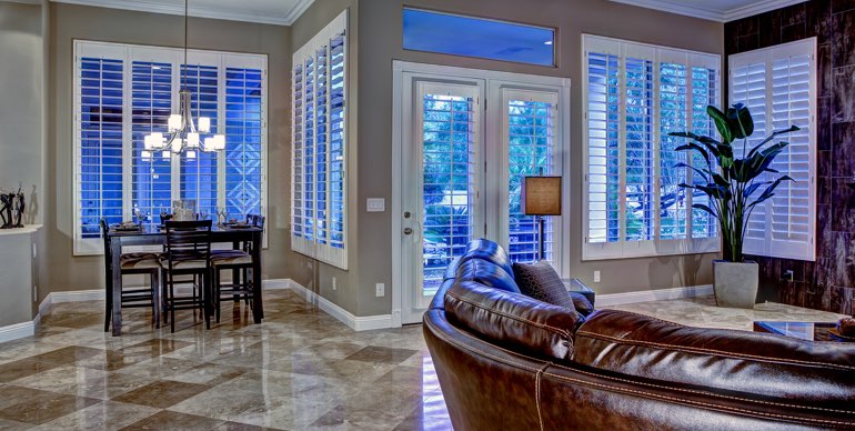 St. George great room with white shutters and leather furniture.